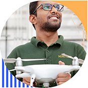 Photo of Nitin Rai holding a drone